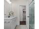 Bright bathroom with a glass-enclosed shower, white vanity with modern fixtures, and neutral tile flooring at 3078 Montreaux Valley Dr, Fort Mill, SC 29707