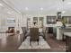 Formal dining room offering hardwood floors and views of the living room and kitchen at 3078 Montreaux Valley Dr, Fort Mill, SC 29707