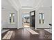 Bright foyer with hardwood floors, white walls, and open doorway revealing a view of the neighborhood at 3078 Montreaux Valley Dr, Fort Mill, SC 29707