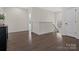 Upstairs hallway with hardwood floors, crown molding, and a staircase, offering a bright and airy space at 3078 Montreaux Valley Dr, Fort Mill, SC 29707