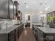 Modern kitchen with stainless steel appliances, granite counters and subway tile backsplash at 3078 Montreaux Valley Dr, Fort Mill, SC 29707