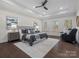 Spacious main bedroom features a tray ceiling, hardwood floors, and large windows at 3078 Montreaux Valley Dr, Fort Mill, SC 29707