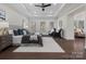 Spacious main bedroom with tray ceiling, hardwood floors, and sitting area at 3078 Montreaux Valley Dr, Fort Mill, SC 29707