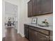 Butler's pantry with sleek cabinets and ample counter space, leading into the dining room at 3078 Montreaux Valley Dr, Fort Mill, SC 29707