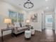 Bright sitting room features sofa, and hardwood floors at 3078 Montreaux Valley Dr, Fort Mill, SC 29707