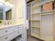 Well-organized closet with built-in shelving adjacent to the bathroom at 3170 Heathstead Pl, Charlotte, NC 28210