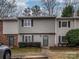 Inviting townhome with gray siding, black shutters, and a well-maintained front yard at 3170 Heathstead Pl, Charlotte, NC 28210