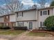 Charming townhome exterior featuring neutral siding and classic shutters at 3170 Heathstead Pl, Charlotte, NC 28210