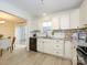 Spacious, updated kitchen with stainless appliances, white cabinets, and granite countertops at 3170 Heathstead Pl, Charlotte, NC 28210