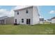 Well-maintained backyard with lush green grass, showcasing the home's exterior and ample outdoor space at 3267 Maple Ridge Dr, Gastonia, NC 28052