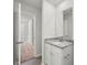 Bright bathroom with granite countertops and white cabinets near hallway at 3267 Maple Ridge Dr, Gastonia, NC 28052