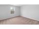 Cozy bedroom with a window and neutral carpet at 3267 Maple Ridge Dr, Gastonia, NC 28052