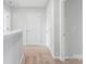 Hallway with carpeted floors leading to multiple doors and rooms at 3267 Maple Ridge Dr, Gastonia, NC 28052