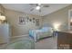 Light-filled bedroom with a ceiling fan, carpet floors, and neutral decor at 3427 Laurel Oak Ln, Gastonia, NC 28056