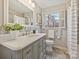 Updated bathroom with vanity, quartz counters, and large mirror at 4132 Sulkirk Rd, Charlotte, NC 28210