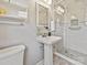 Bathroom featuring a pedestal sink, glass shower, and storage at 4132 Sulkirk Rd, Charlotte, NC 28210