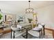 Bright dining room with an open view of the living room, creating a seamless flow at 4132 Sulkirk Rd, Charlotte, NC 28210