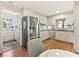Charming kitchen with stainless steel appliances, white cabinets, and hardwood floors at 4132 Sulkirk Rd, Charlotte, NC 28210