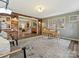 Bright home office featuring exposed brick, neutral paint, a wooden desk, and ample light at 4132 Sulkirk Rd, Charlotte, NC 28210