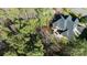 Overhead view of house with stone patio, fire pit, and private treed lot at 4268 Rustling Woods Dr, Denver, NC 28037