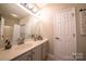 Bathroom features include a large mirror, white cabinets, and a white door at 4268 Rustling Woods Dr, Denver, NC 28037