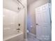 Bathroom with a shower and toilet; a white door leads to another room at 4268 Rustling Woods Dr, Denver, NC 28037