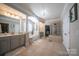 Expansive bathroom with dual vanities, soaking tub, glass-enclosed shower, and access to walk-in closet at 4268 Rustling Woods Dr, Denver, NC 28037