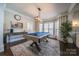 Fun game room featuring a pool table, stylish lighting, and a large area rug perfect for entertaining at 4268 Rustling Woods Dr, Denver, NC 28037