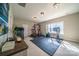 Bright home gym features carpeted floors, rubber mats, large windows, and various workout equipment at 4268 Rustling Woods Dr, Denver, NC 28037
