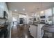 Spacious kitchen featuring stainless steel appliances, a large island with bar seating and hardwood floors at 4268 Rustling Woods Dr, Denver, NC 28037