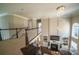 Open-concept living area featuring high ceilings, a fireplace, and large windows for natural light at 4268 Rustling Woods Dr, Denver, NC 28037