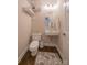 Modern powder room features floating sink, wall-mounted toilet, and stylish fixtures at 4268 Rustling Woods Dr, Denver, NC 28037