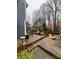 Spacious wooden back deck furnished with seating, perfect for outdoor relaxation and entertaining at 4922 Rivergreen Ln, Charlotte, NC 28227