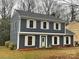 Charming two-story home with gray siding, white shutters, and a well-manicured front yard at 4922 Rivergreen Ln, Charlotte, NC 28227