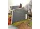 View of the home's side exterior, showing the siding, roofline, and access to the backyard at 4922 Rivergreen Ln, Charlotte, NC 28227