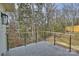 Spacious backyard deck with sleek railing, providing scenic views of the surrounding landscape at 5026 Ohm Ln, Charlotte, NC 28270