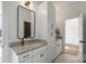 Bathroom with white cabinets, granite countertop and a mirror at 5026 Ohm Ln, Charlotte, NC 28270
