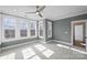 Bedroom with neutral carpet, neutral grey walls and many windows at 5026 Ohm Ln, Charlotte, NC 28270