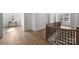Open foyer with hardwood floors and staircase featuring modern iron spindles and wood railing at 5026 Ohm Ln, Charlotte, NC 28270