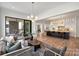 Bright open living space and kitchen with hardwood floors, and modern décor at 5026 Ohm Ln, Charlotte, NC 28270