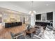 Open-concept kitchen and living space with modern décor and hardwood flooring at 5026 Ohm Ln, Charlotte, NC 28270