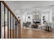 Bright living room with fireplace, hardwood floors, and view of dining area at 5026 Ohm Ln, Charlotte, NC 28270