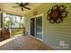 Relaxing back porch featuring a ceiling fan and ample space to unwind while enjoying views of the surrounding landscape at 5051 Oxbow Run Ln, York, SC 29710