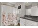 Bathroom with tiled floors, granite countertop, shower and flower-themed shower curtain at 5051 Oxbow Run Ln, York, SC 29710