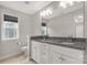 Bright bathroom features double vanity with granite countertop and neutral walls at 5051 Oxbow Run Ln, York, SC 29710