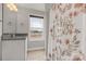 Bright bathroom featuring a granite vanity top, floral shower curtain, and a large window with a view at 5051 Oxbow Run Ln, York, SC 29710