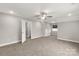 Large, carpeted bedroom featuring a ceiling fan and plenty of natural light at 5051 Oxbow Run Ln, York, SC 29710