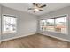 Bright bedroom with wood-look floors, a ceiling fan, and large windows offering nice views at 5051 Oxbow Run Ln, York, SC 29710
