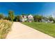 Beautiful two-story home on a sunny lot, with a long driveway leading to the house at 5051 Oxbow Run Ln, York, SC 29710