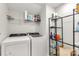 Well-organized laundry room with modern washer, dryer, and shelving units at 5051 Oxbow Run Ln, York, SC 29710